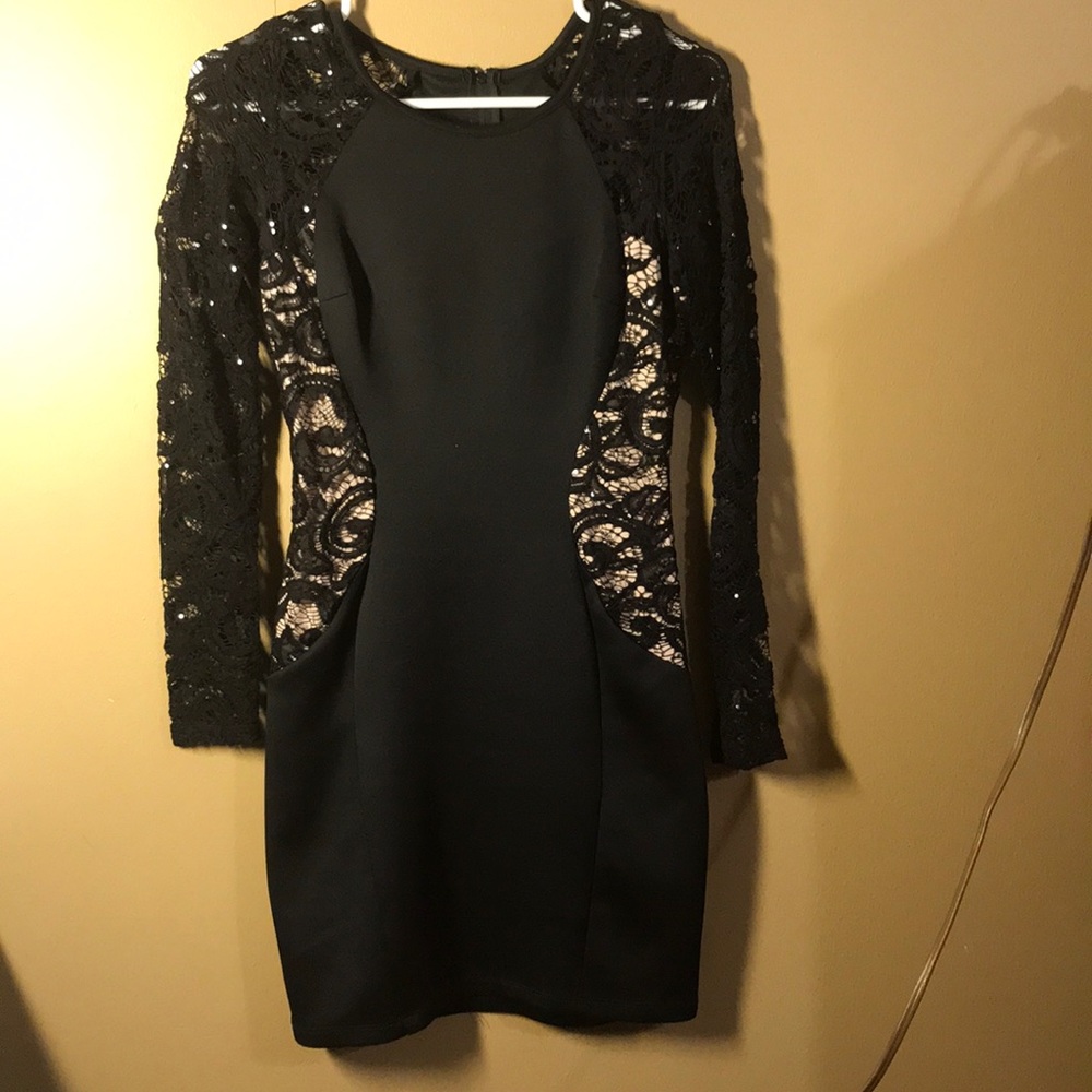 Black, long sleeve laced, tight fitted dress.
